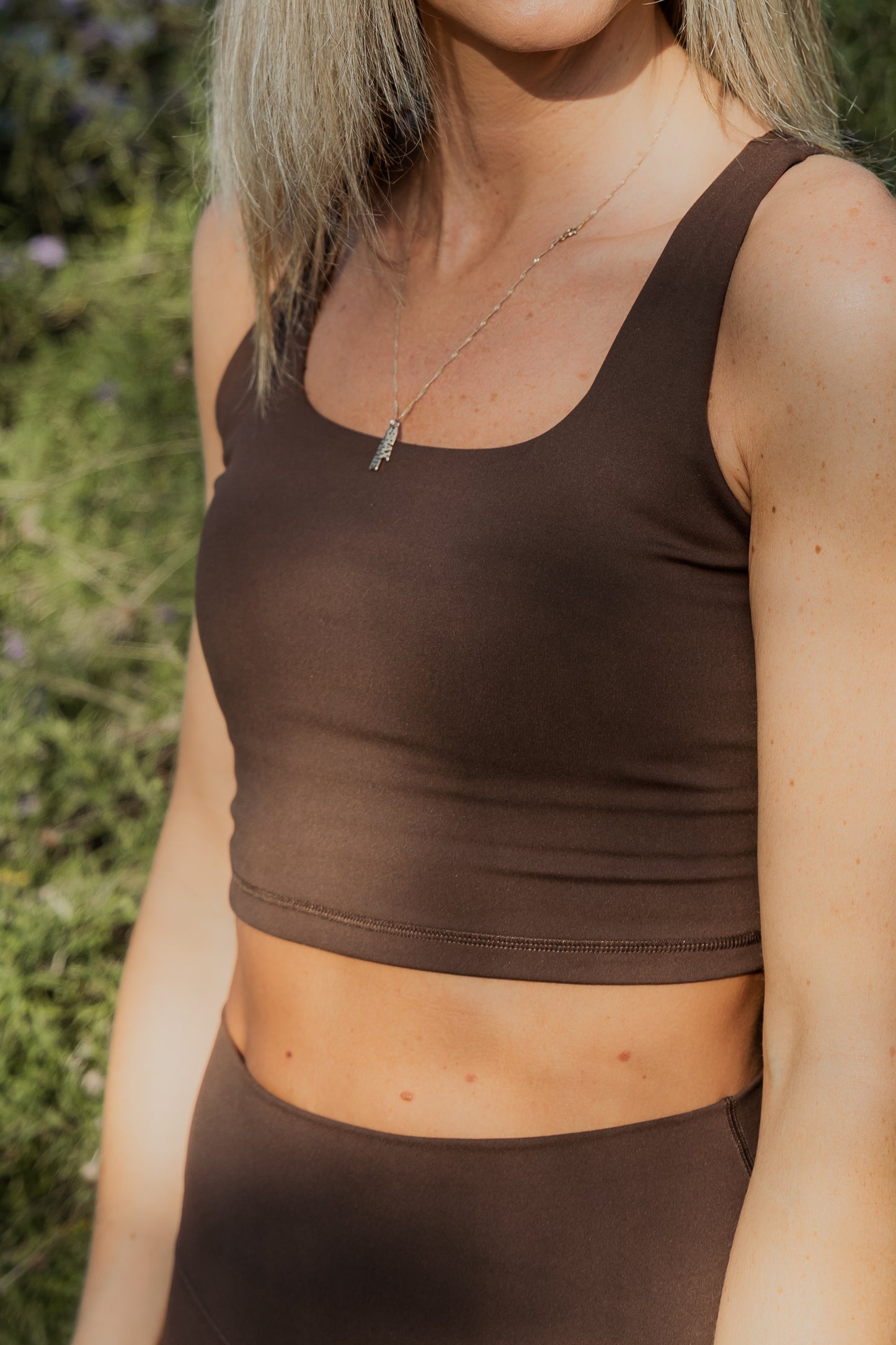 Up close photo of a brown tank top sports bra.